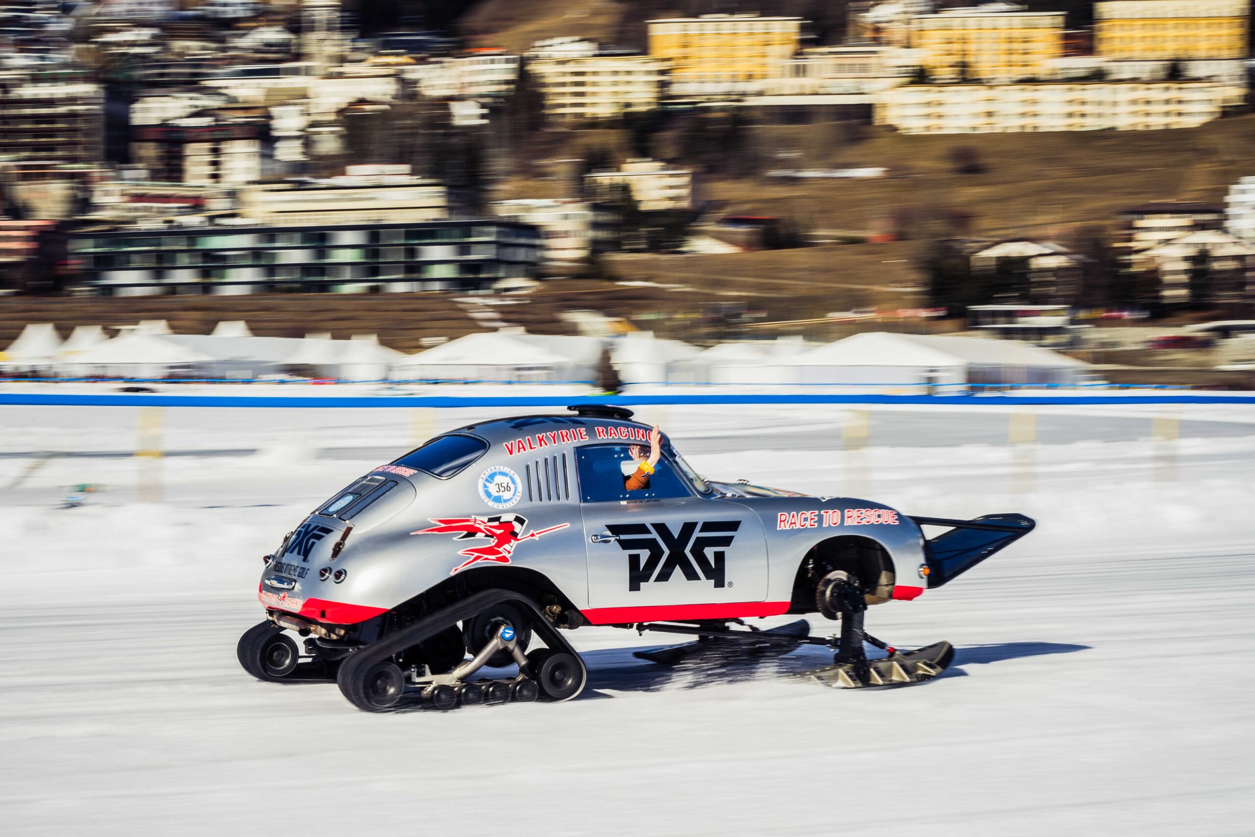 Modified Porsche snowmobile with skis and tracks, labeled “Valkyrie Racing,” speeding on ice at The I.C.E. St. Moritz 2023