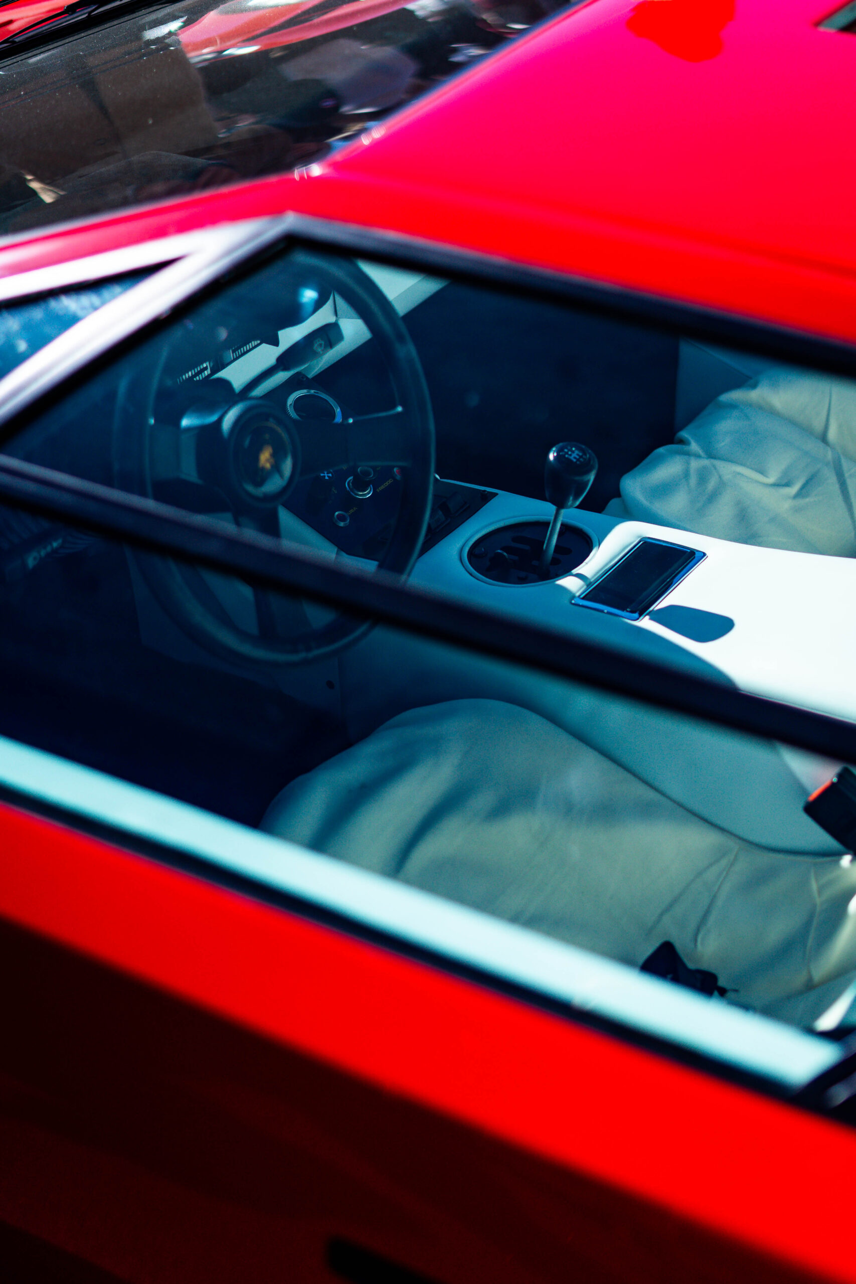 Close-up of a Lamborghini interior, highlighting the steering wheel and gear shift, captured during The I.C.E. St. Moritz 2023